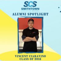 alumni spotlight image of man with crossed arms